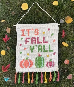 Crochet Wall Hanging that reads It's Fall Y'All with pumpkins underneath