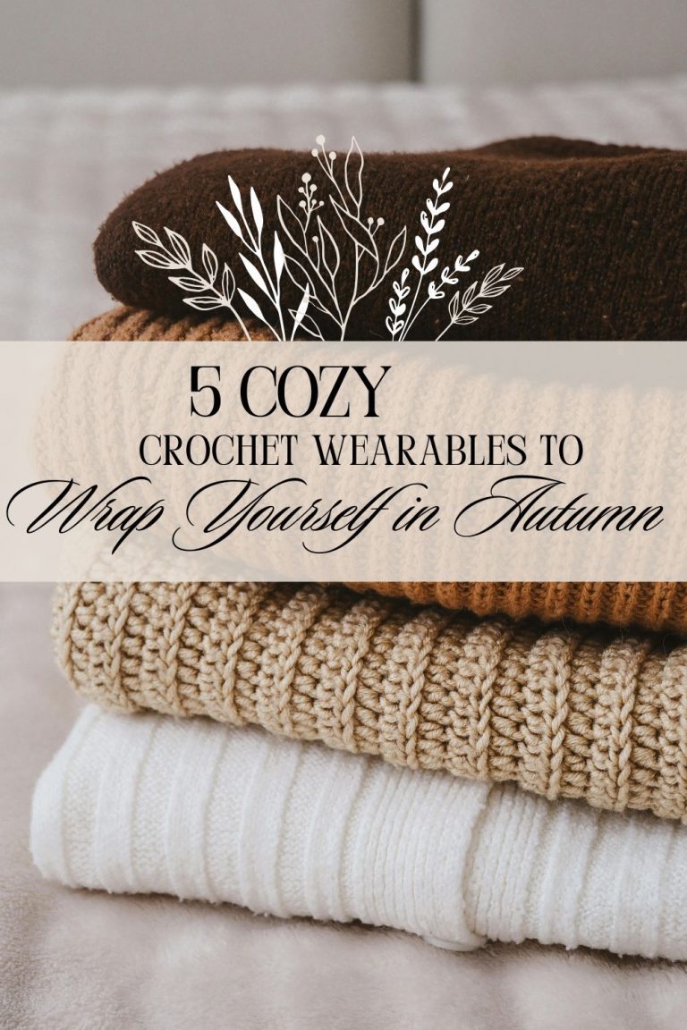 Stack of folded crochet sweaters in warm neutral tones—beige, brown, and cream—styled on a soft surface with botanical overlays and text that reads '5 Cozy Crochet Wearables to Wrap Yourself in Autumn.' Aesthetic fall image evoking comfort, handmade fashion, and seasonal charm.