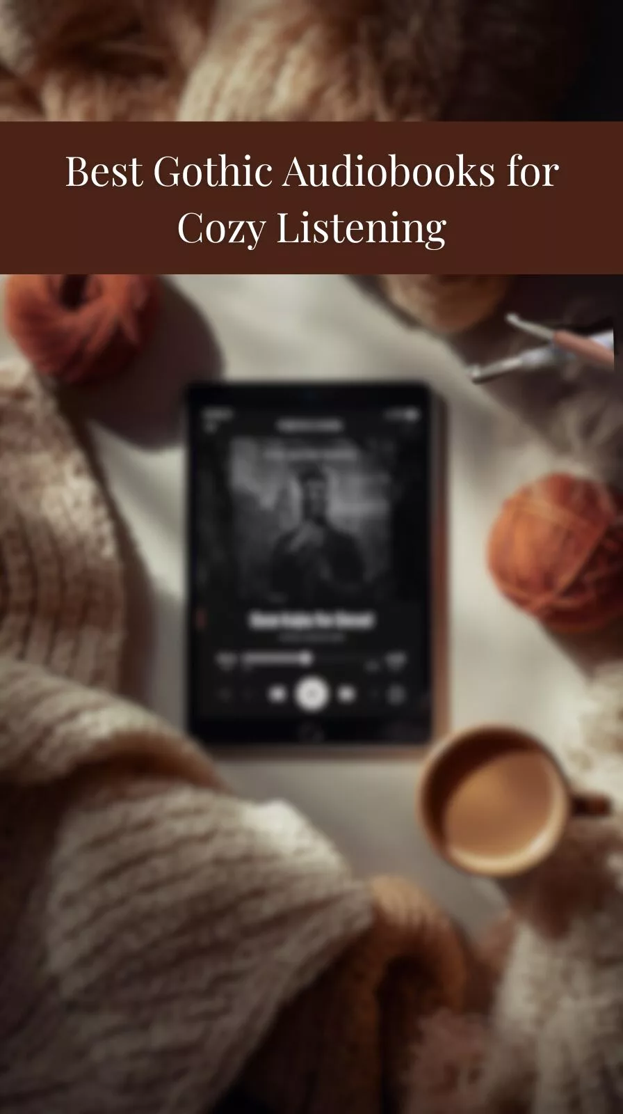 Tablet playing a gothic audiobook surrounded by yarn, crochet hooks, blanket, and coffee in a cozy setting.