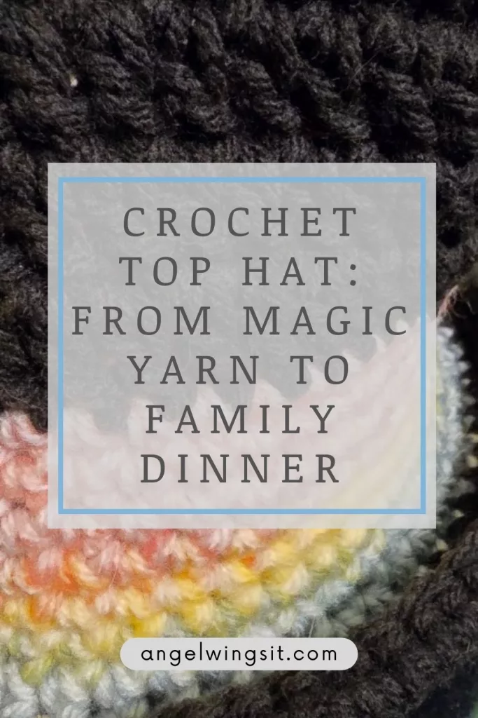 A vibrant, handmade crochet top hat featuring the colorful Rainbow Mist yarn pattern with a black brim and top, displayed on a wooden surface.