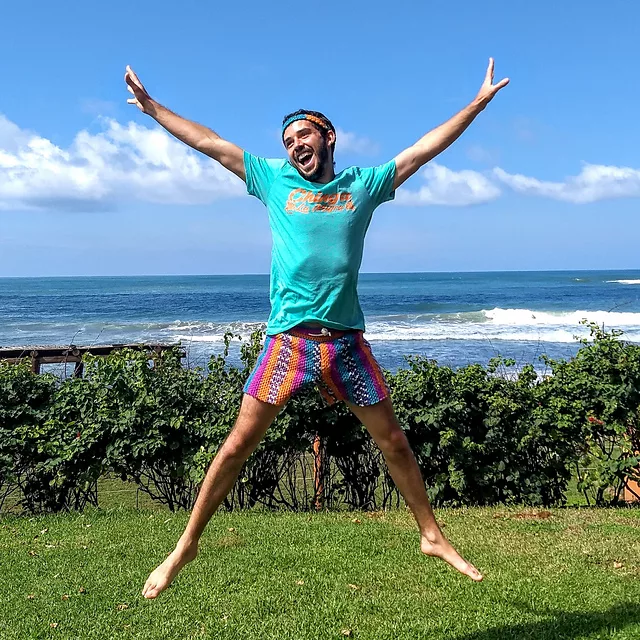 man jumping wearing crochet shorts