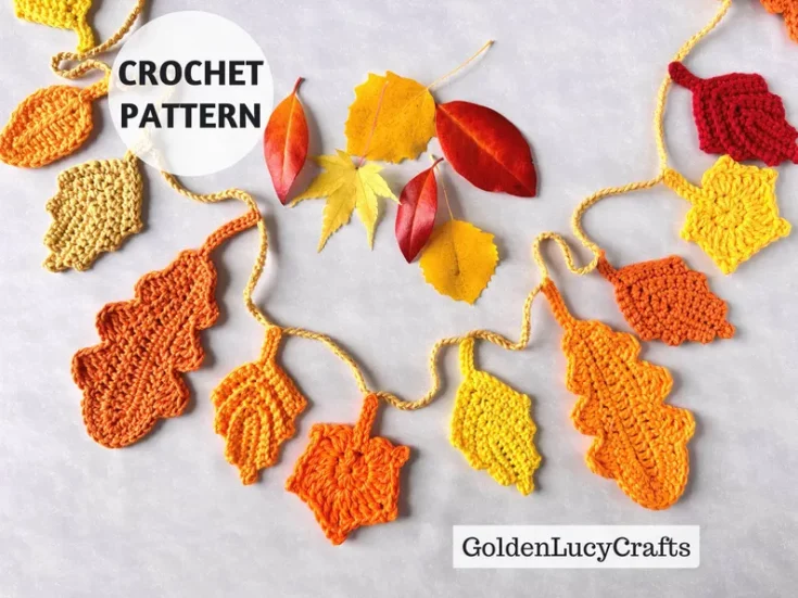 Collage of colorful crocheted autumn leaves in yellow, orange, and red resting on a wooden surface.