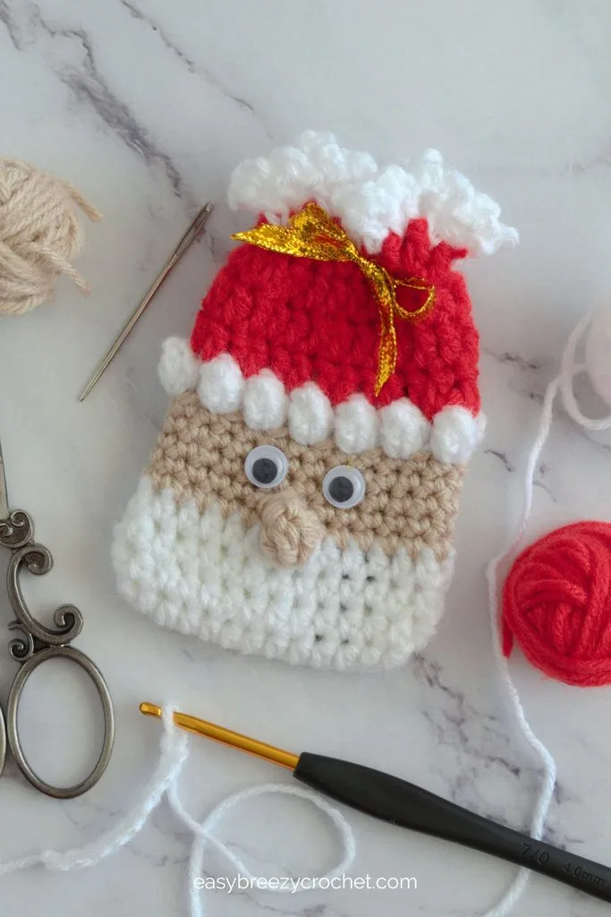 Crocheted Santa, elf, and Grinch gift card holder pouches