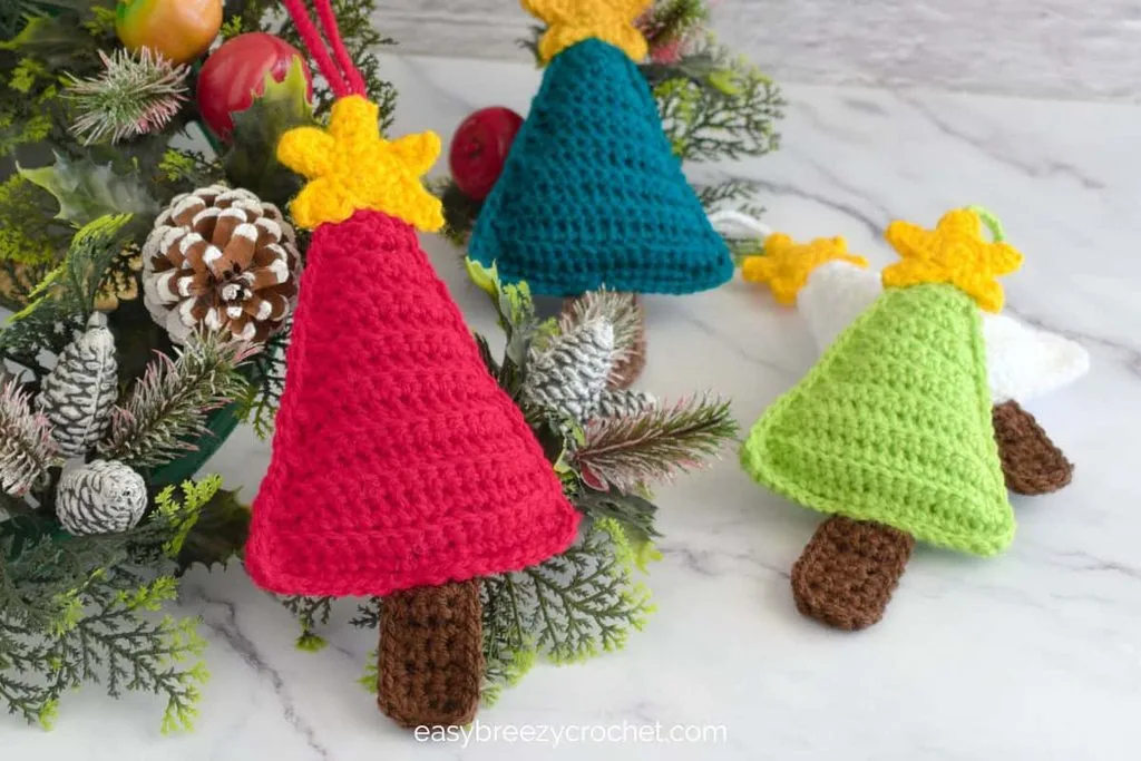 Small ribbed green crocheted Christmas tree with a yellow star on top